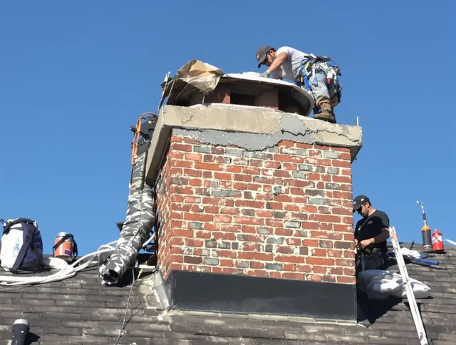 Avon Lake Chimney Sweep installing a custom chimney crown in Avon Lake, OH