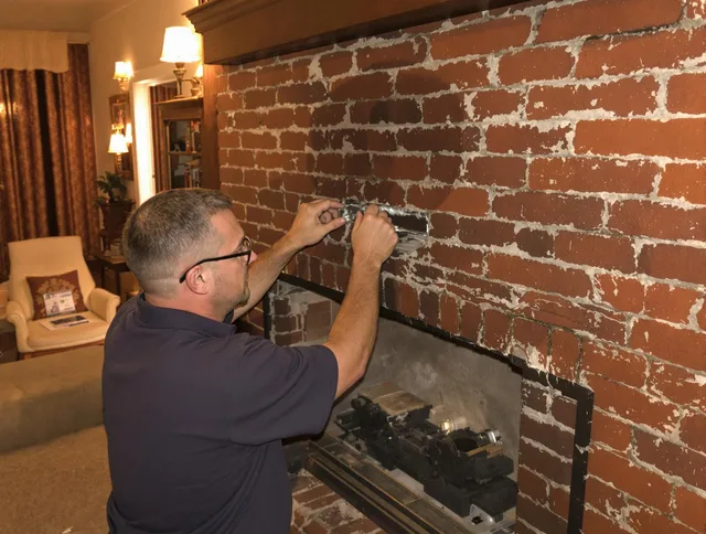 Avon Lake Chimney Sweep expert fixing a fireplace in Avon Lake, OH